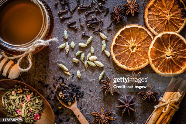aromatic spices with copy space on a dark textured backdrop - star anise stock pictures, royalty-free photos & images