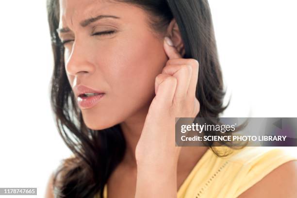 woman with ear pain - ohrenschmerzen stock-fotos und bilder
