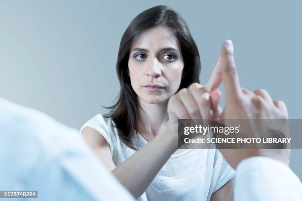 patient undergoing finger to nose test - proprioception stock pictures, royalty-free photos & images