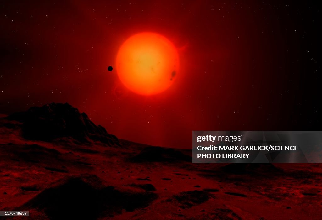 Red dwarf seen from a planet, illustration