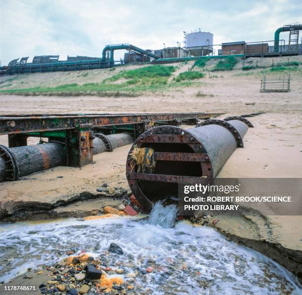 outflow to sea from chemical works - water pollution pipe stock pictures, royalty-free photos & images