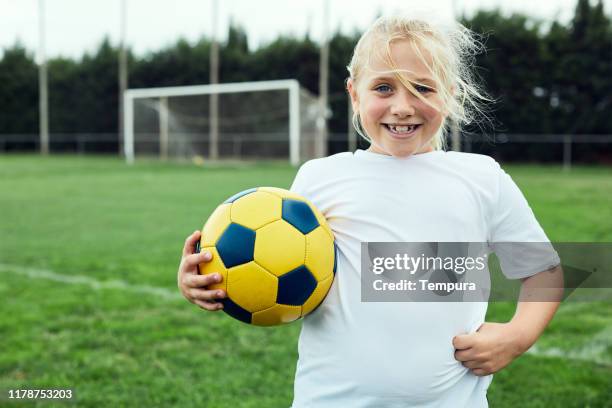 eight years old soccer player portrait looking at camera. - 8 9 years imagens e fotografias de stock