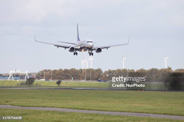 Ryanair low cost carrier, Boeing 737-8AS aircraft as seen on final approach landing on Polderbaan runway 18R/36L at Amsterdam Schiphol International...