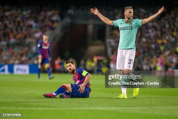 October 2: Milan kriniar of Internazionale protests the decision as Lionel Messi of Barcelona is awarded a free kick after a foul on him on the edge...