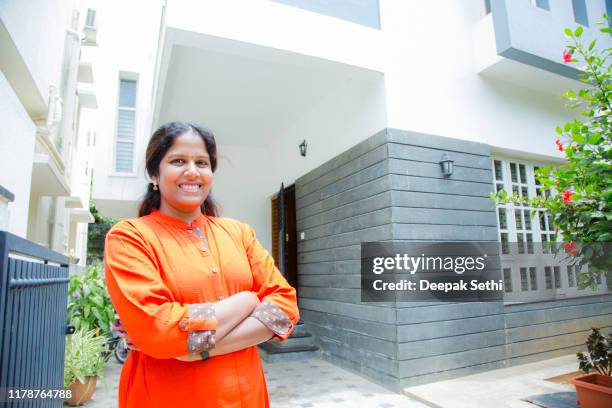 woman standing outside home stock photo - south india stock pictures, royalty-free photos & images