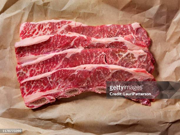 thin cut, raw beef short ribs - beef stock pictures, royalty-free photos & images