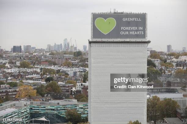General view of what remains of Grenfell Tower covered with hoardings following a severe fire in June 2017 on October 29, 2019 in London, England....