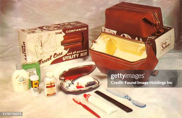 Items in a travel utility kit including toothbrush and toothpaste, hairbrush and cologne.