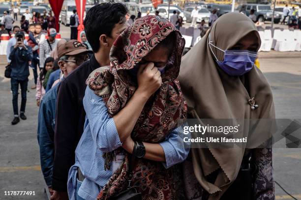Relatives of the passengers of the 2018 Lion Air flight JT-610 board the Indonesian Navy ship KRI Semarang to visit the site where the aircraft...