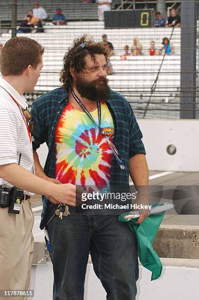 Survivor's Rupert Boneham receives last-minute instructions prior to waving the green flag to open the final practice for the Indianapolis 500.