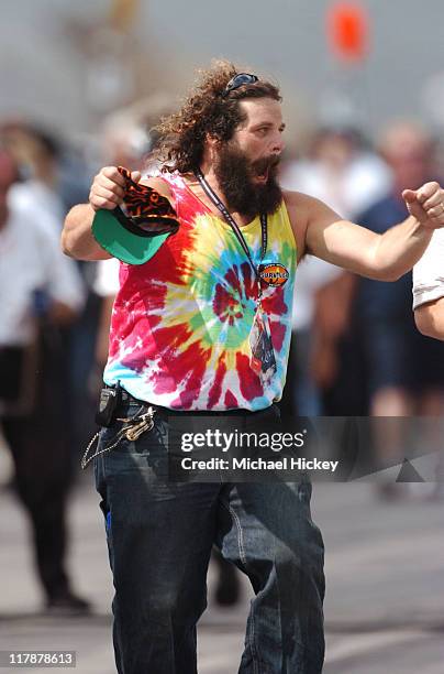 Survivor's Rupert Boneham walks in the pits of the Indianapolis Motor Speedway on Carbueration Day.