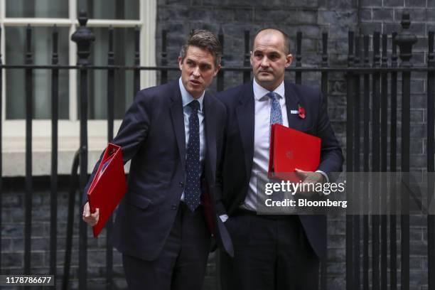 Gavin Williamson, U.K. Education secretary, left, and Jake Berry, U.K. Northern powerhouse minister, depart following a meeting of cabinet ministers...
