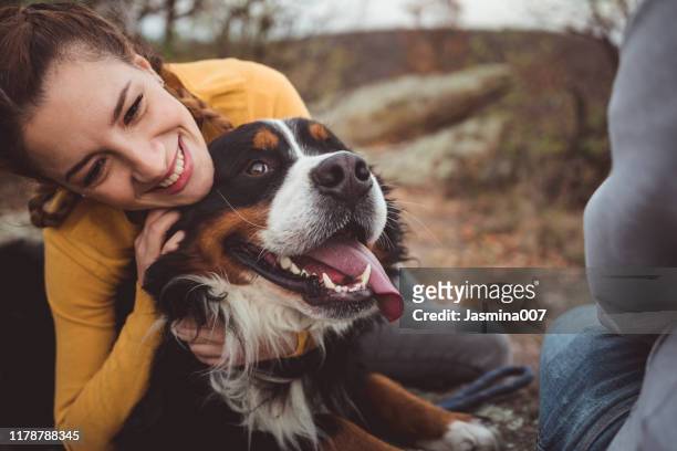 young woman with dog - dog cute winter stock pictures, royalty-free photos & images