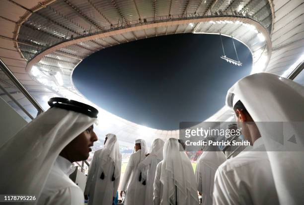 Fans in thawbs look on during day seven of 17th IAAF World Athletics Championships Doha 2019 at Khalifa International Stadium on October 03, 2019 in...