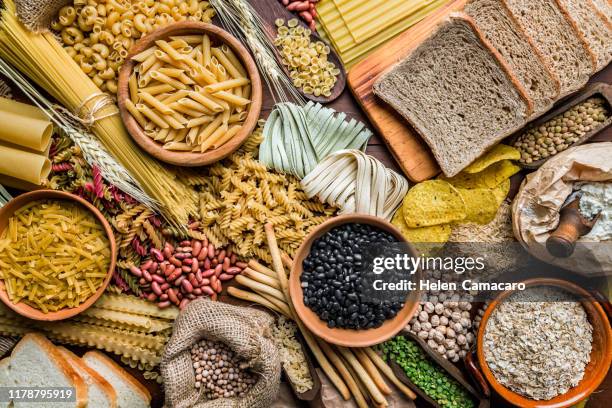 wholegrain and dietary fiber food on rustic wooden background - ballaststoffe stock-fotos und bilder