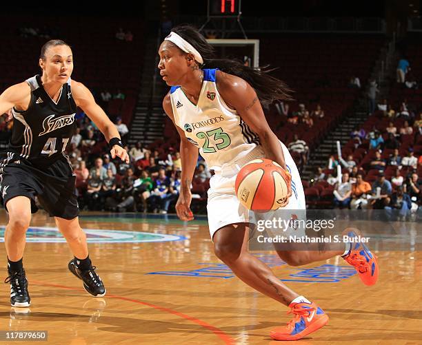 Cappie Pondexter of the New York Liberty drives against Tully Bevilaqua of the San Antonio Silver Stars during a game on July 1, 2011 at the...