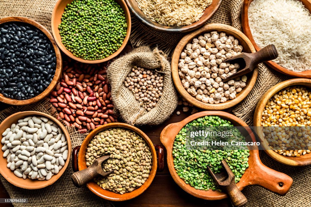 Top view of leguminous seeds on rustic wood table