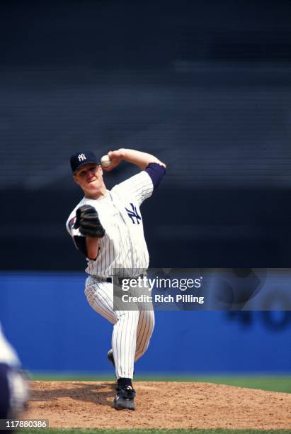 Jim Abbott of the New York Yankees delivers a pitch during a game against the Kansas City Royals at Yankee Stadium on June 5, 1994 in the Bronx, New...