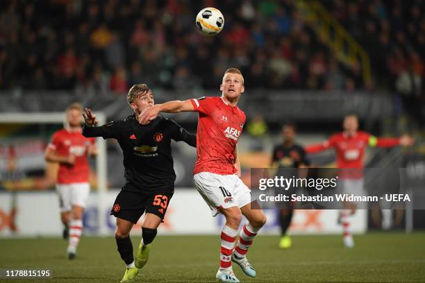 Brandon Williams of Manchester United and Dani de Wit of AZ Alkmaar compete for the ball during the UEFA Europa League group L match between AZ...