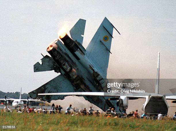 Fighter jet crashes into a crowd of spectators at an air show July 27, 2002 in Lviv, Ukraine. The two crewmen ejected and survived, but at least 83...