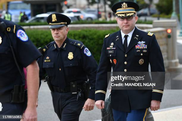 National Security Council Director for European Affairs Alexander Vindman arrives for a closed-door deposition at the US Capitol in Washington, DC on...