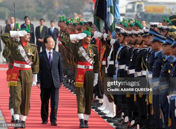 Chinese Prime Minister Wen Jiabao inspects a guard of honour during a welcome ceremony at the Pakistani military Chaklala airbase in Rawalpindi on...