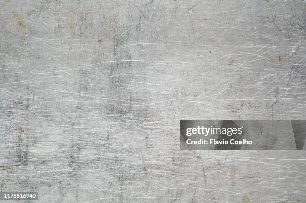 metallic surface scratched and stained - metal background stock-fotos und bilder