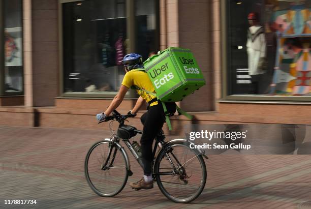 An Uber Eats food courier rides in the city center on October 03, 2019 in Kiev, Ukraine. Uber has established itself firmly in Kiev and is now facing...