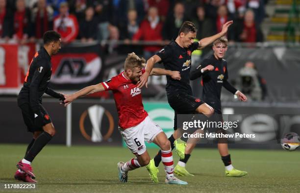 Nemanja Matic of Manchester United in action with Fredrik Midtsjo of AZ Alkmaar during the UEFA Europa League group L match between AZ Alkmaar and...