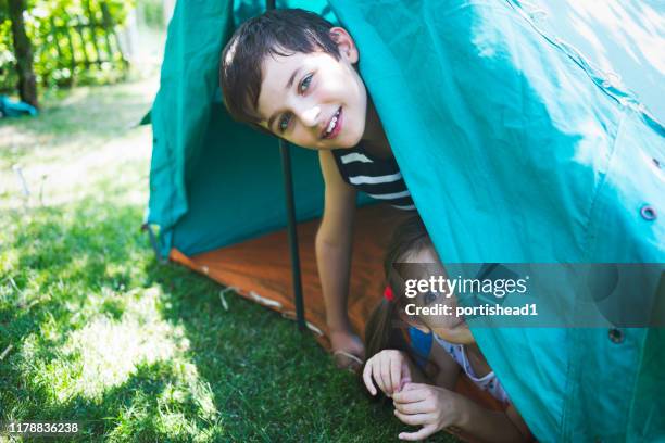 happy kids in a tent - kids tent stock pictures, royalty-free photos & images