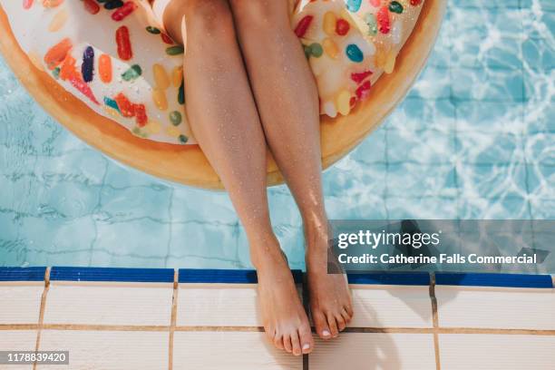 rubber ring - ring swimming pool stock pictures, royalty-free photos & images