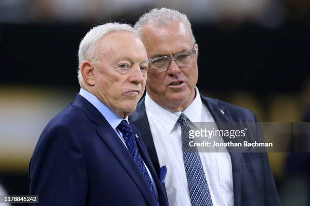Owner Jerry Jones of the Dallas Cowboys and Executive Vice President Stephen Jones talk before a game against the New Orleans Saints at the Mercedes...