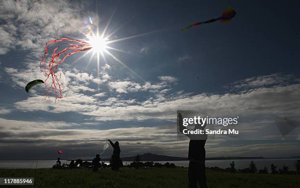 Kite enthusiasts fly kites as part of Manu Aute Kite Day during the Matariki Kite Festival at Bastion Point on July 2, 2011 in Auckland, New Zealand.