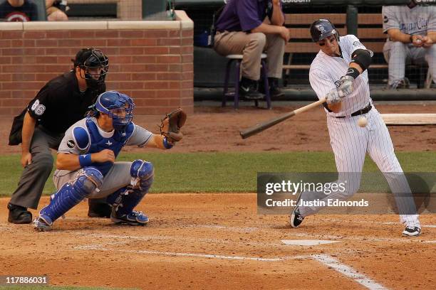 Troy Tulowitzki of the Colorado Rockies his a two-run home run off of starting pitcher Danny Duffy of the Kansas City Royals during the third inning...