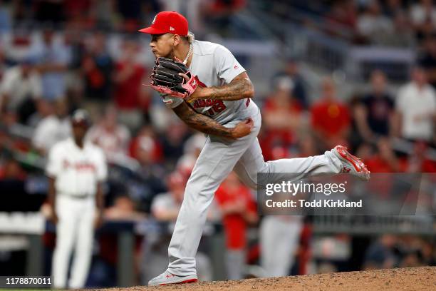 Carlos Martinez of the St. Louis Cardinals strikes out Nick Markakis of the Atlanta Braves to give his team the 7-6 win over the Atlanta Braves in...