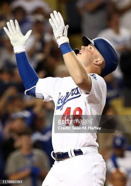 Gavin Lux of the Los Angeles Dodgers celebrates his a solo home run in the eighth inning of game one of the National League Division Series against...