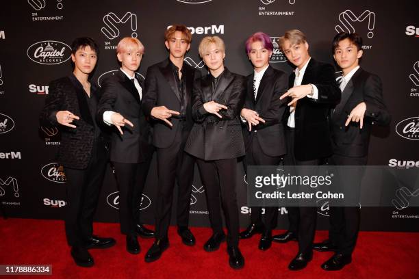 Ten, Baekhyun, Lucas, Taemin, Taeyong, Kai and Mark Lee of SuperM attend Premiere Event Live From Capitol Records in Hollywood at Capitol Records...