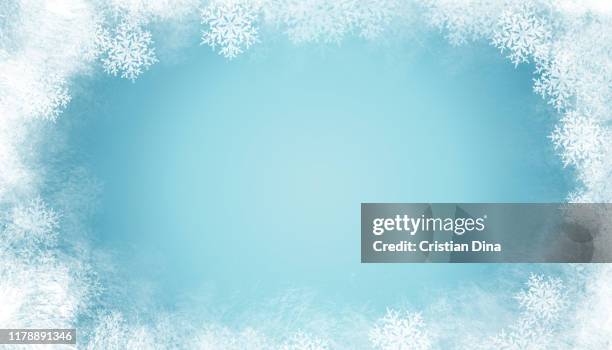 abstract winter background with snowflakes and ice on blue color basic - ghiacciato foto e immagini stock