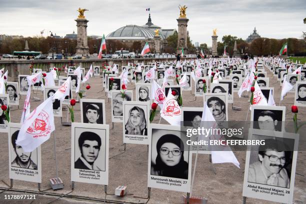 Some 800 portraits of victims have been displayed by representatives in France of the People's Mujahedin of Iran on the Esplanade des Invalides in...