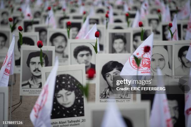 Some 800 portraits of victims have been displayed by representatives in France of the People's Mujahedin of Iran on the Esplanade des Invalides in...