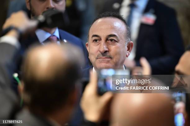 Turkish foreign minister Mevlut Cavusoglu arrives ahead of a meeting of the Syria constitution-writing committee on October 29, 2019 at the United...