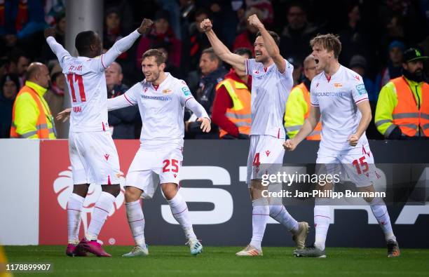 Anthony Ujah, Christopher Lenz, Christian Gentner and Marius Buelter of 1 FC Union Berlin celebrate after scoring the 1:3 during the DFB Cup match...