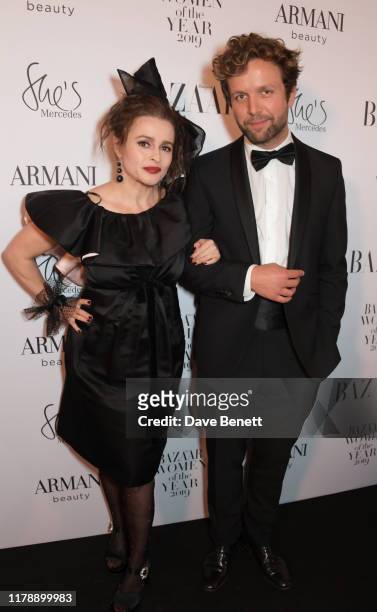 Helena Bonham Carter and Rye Dag Holmboe attend the Harper's Bazaar Women of the Year Awards 2019, in partnership with Armani Beauty, at Claridge's...