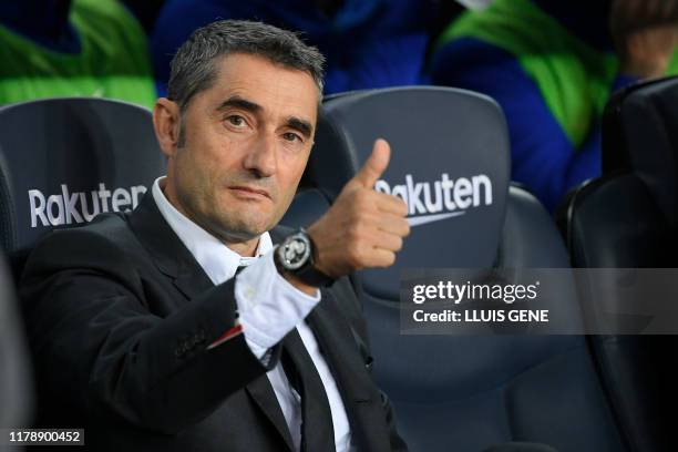 Barcelona's Spanish coach Ernesto Valverde gives a thumbs-up before the Spanish league football match between FC Barcelona and Real Valladolid FC at...