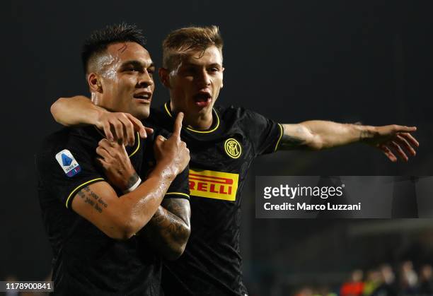 Lautaro Martinez of FC Internazionale celebrates with his team-mate Nicolo Barella after scoring the opening goal during the Serie A match between...