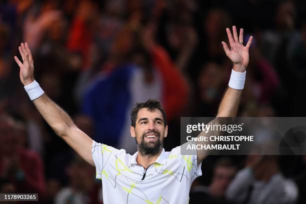 France's Jeremy Chardy celebrates after winning against Russia's Daniil Medvedev during their men's singles tennis match on day two of the ATP World...