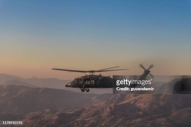 uh-60 black hawk military helicopter - afghanistan desert stock pictures, royalty-free photos & images