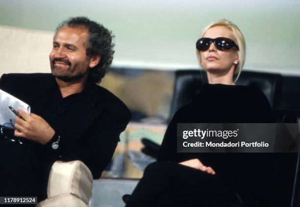 Italian fashion designer Gianni Versace in the company of his sister Donatella Versace. 1980s