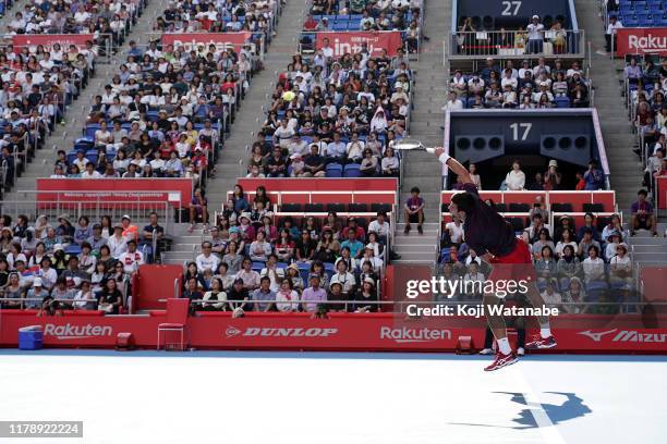 Novak Djokovic of Serbia severs shot during his match against Lucas Pouille of France on day five of the Rakuten Open at the Ariake Coliseum on...