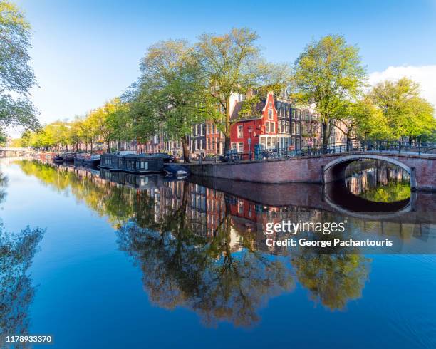 morning colors and architecture in amsterdam, the netherlands - amsterdam stock-fotos und bilder